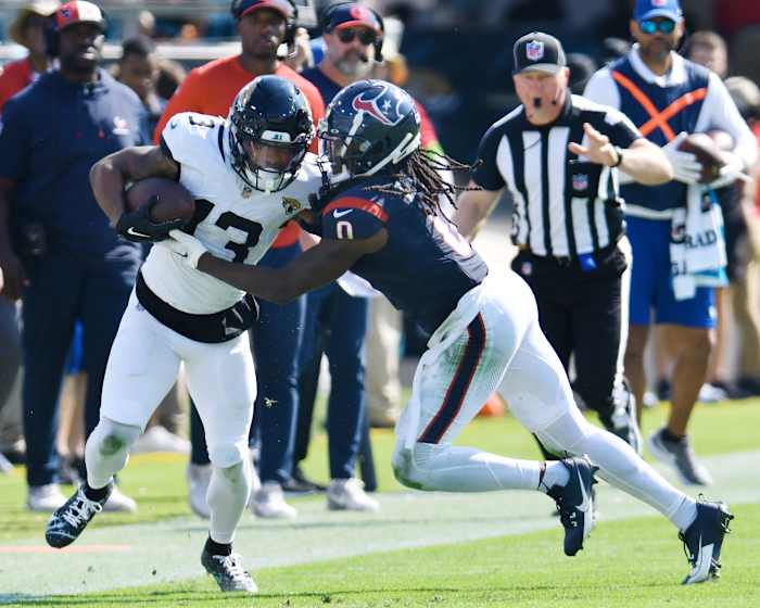 Houston Texans cornerback Shaquill Griffin (0) pushes Jacksonville Jaguars wide receiver Christian Kirk (13) out of bounds on a fourth quarter pass play for a first down. The Jacksonville Jaguars hosted the Tennessee Titans at EverBank Stadium in Jacksonville, Fla. Sunday, September 24, 2023. The Jaguars trailed 17 to 0 at the end of the first half and lost with a final score of 37-17. [Bob Self/Florida Times-Union]